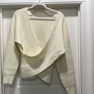 Cream, short, crossed over.